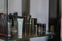 a shelf filled with lots of different types of skin care products