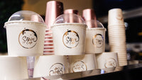 a close up of cups on a shelf